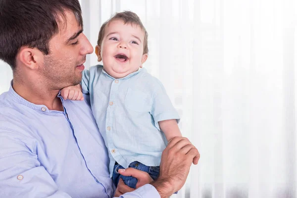 Father carrying his son. Good health baby smiling on shoulder of — Stock Photo, Image