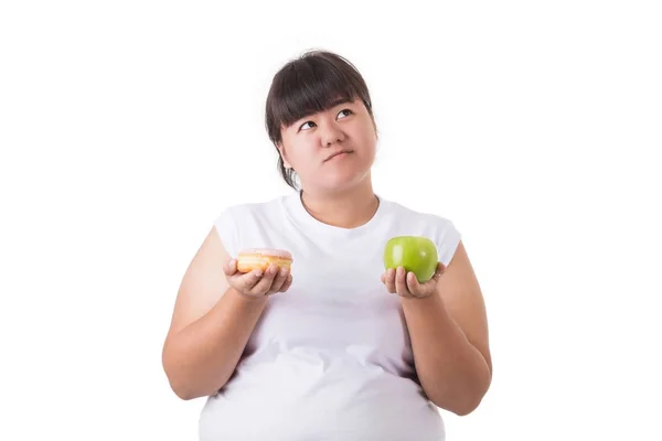 Fat asian woman wearing white t-shirt and choosing to eat green — Stock Photo, Image