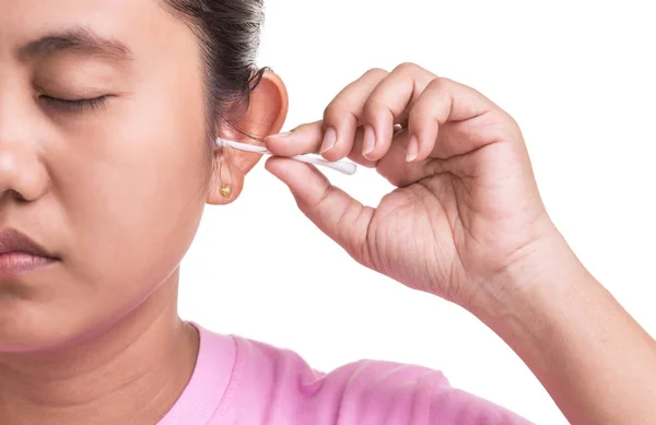 Woman cleaning her ear by using cotton bud stick isolated on whi — Stock Photo, Image