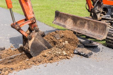 Kazıcı makine işletmek toprak ve onarım yol p kazma için