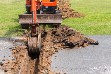 Kazıcı makine işletmek toprak ve onarım yol p kazma için