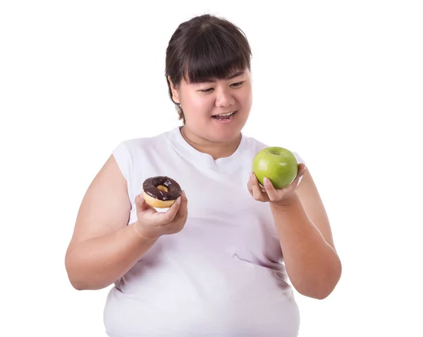 Gorda asiática mujer vistiendo blanco camiseta y la elección de comer verde — Foto de Stock