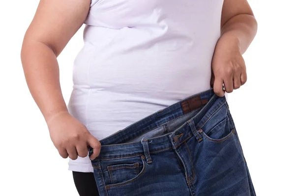 Fat asian woman trying to wear small size jeans isolated on whit — Stock Photo, Image