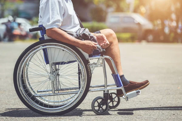 Disabled people sitting on the wheelchair in the park — Stock Photo, Image