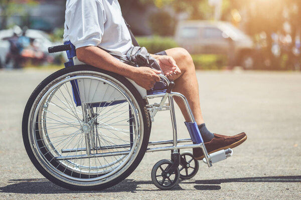 Disabled people sitting on the wheelchair in the park