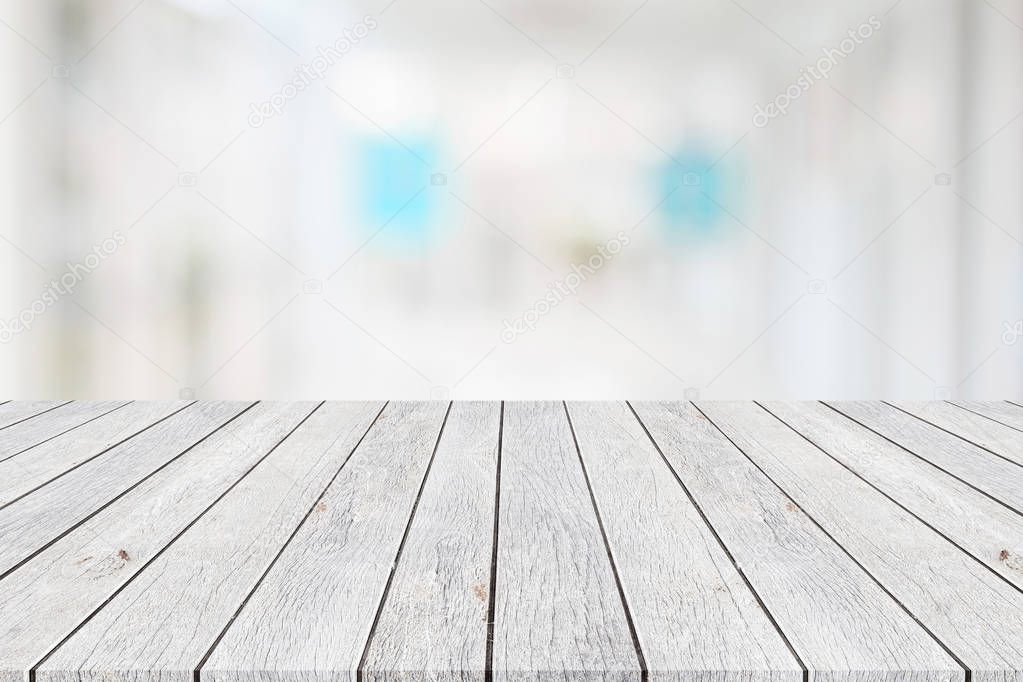 Wooden board or table and abstract blurred background. Free spac