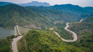 Asphalt road on the hill in Phetchabun province, Thailand. Aeria clipart