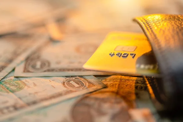 Credit card in black leather wallet on top of US dollar banknote — Stock Photo, Image