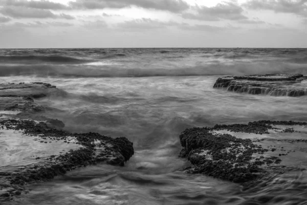 Black and white of the Mediterranean Sea near Haifa Israel.