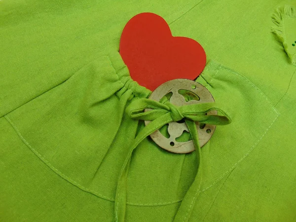 Green dress with a pocket and a red \