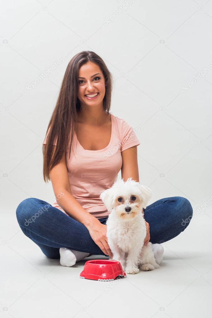 woman with maltese dog and bowl