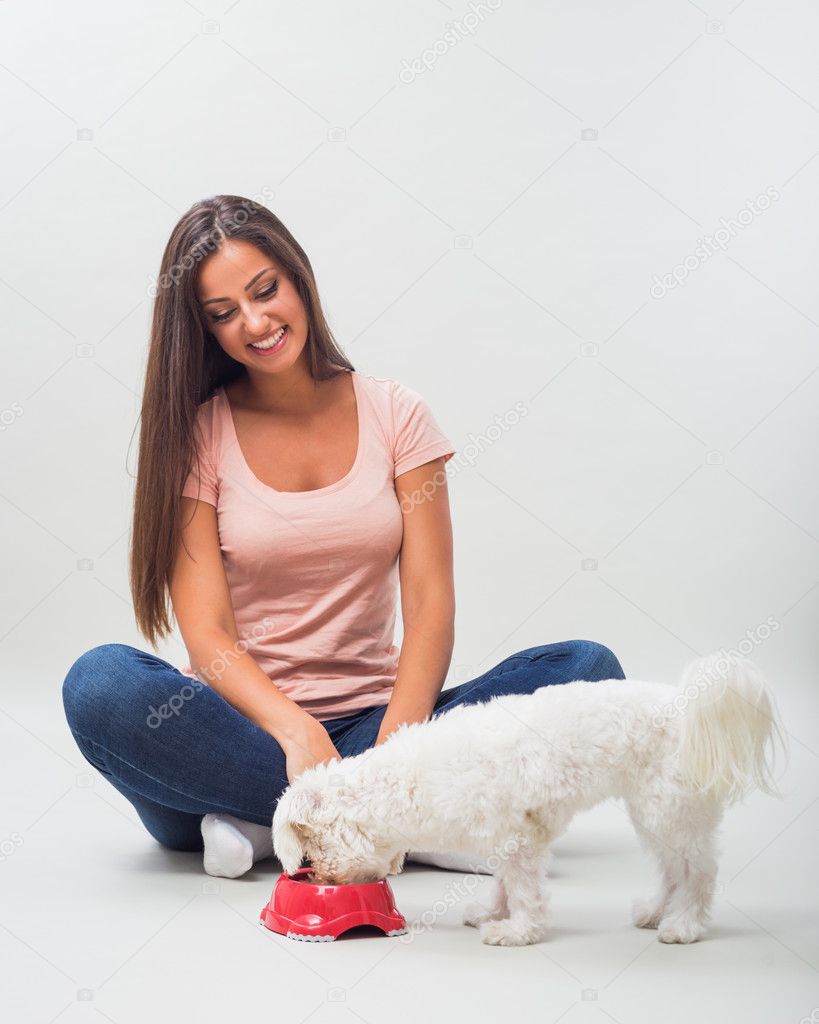 woman with maltese dog and bowl