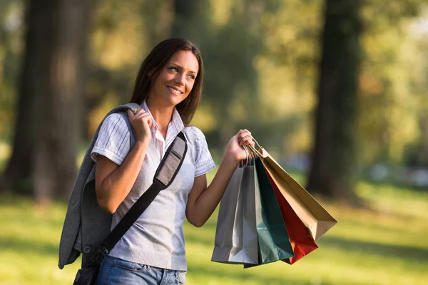 Businesswoman holding shopping bags — Stock Photo, Image