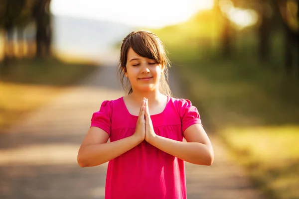 Little girl  meditating — Stock Photo, Image