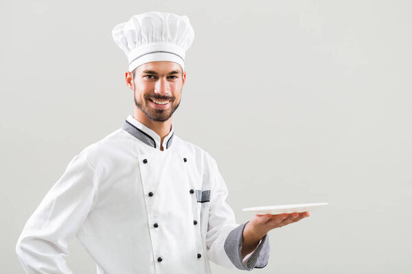 Chef  holding plate 