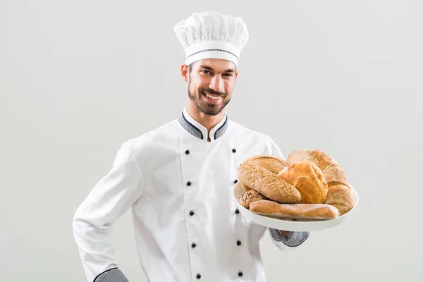 Baker bedrijf bos van brood — Stockfoto