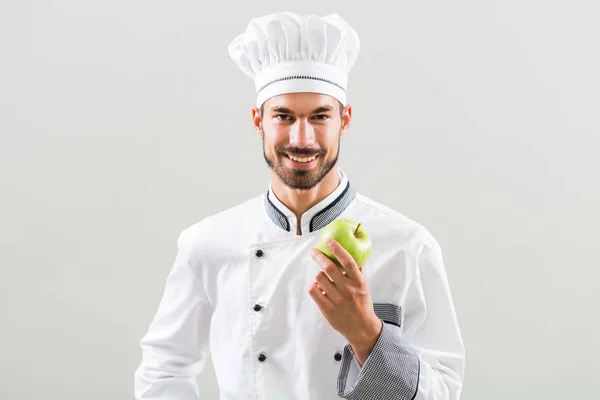 Kuchař zobrazeno jablko — Stock fotografie