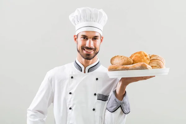 Baker hospodářství banda chleba — Stock fotografie