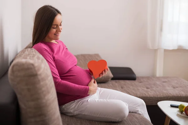 Happy Pregnant Woman Holding Red Heart Shape — Stock Photo, Image