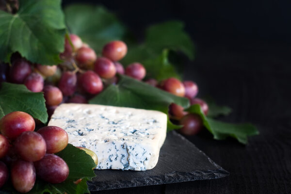 Blue cheese with grape background