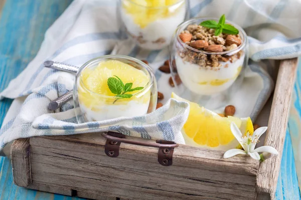 Yogurt with granola and grapefruit — Stock Photo, Image