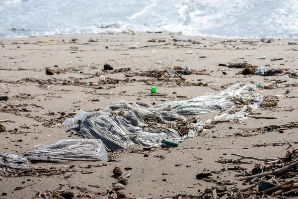 Big Plastic Bag Forehead Polluting Beach Other Wastes Coming Humans Royalty Free Stock Photos
