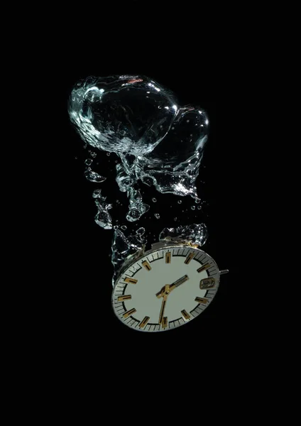 Photo hours on a black background under water