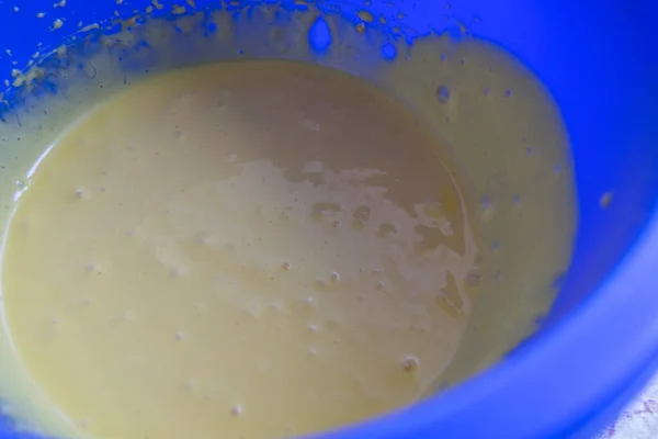 Close Blue Bowl Liquid Dough — стоковое фото