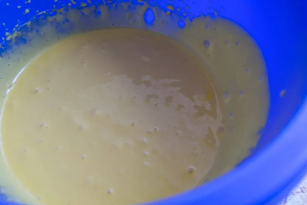 Close Blue Bowl Liquid Dough — Photo
