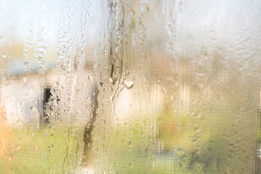rain drops on sweaty glass window