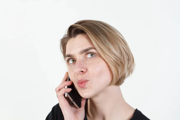 Businesswoman talking on the phone very emotional. She smile, anger, aggression, misunderstood, outrage. On a white background. Happy smiling successful businesswoman with cell phone, isolated on whit — Stock Photo, Image