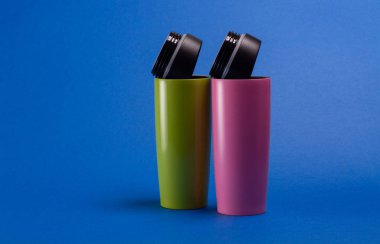 two multi-colored thermal shaker bottles for sports nutrition on
