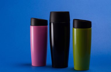three multi-colored thermal bottles of shaker for sports nutriti