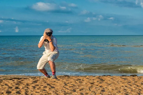 Fotógrafo en una playa —  Fotos de Stock