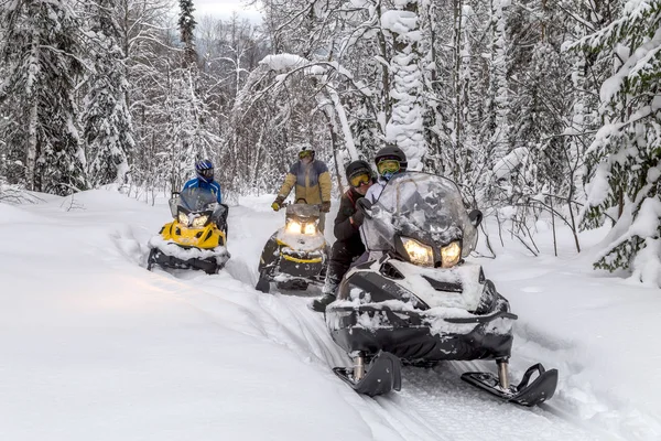 Athletes on a snowmobile — Stock Photo, Image