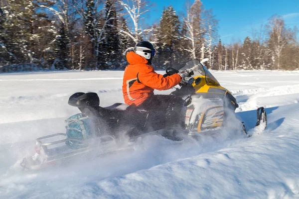 Athlete on a snowmobile — Stock Photo, Image