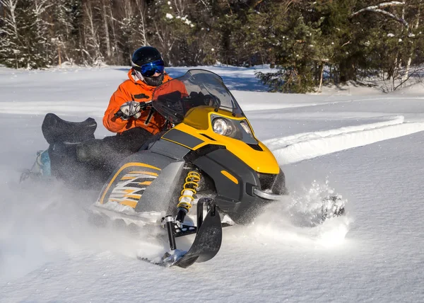 Athlete on a snowmobile — Stock Photo, Image
