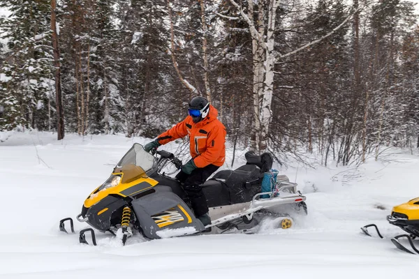 Athlete on a snowmobile. — Stock Photo, Image