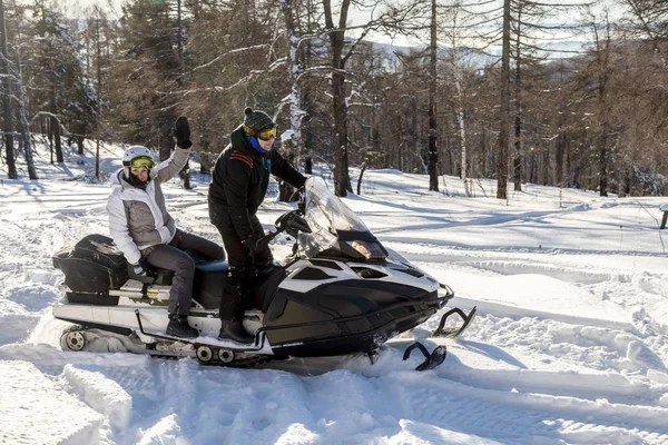 Athletes on a snowmobile. — Stock Photo, Image