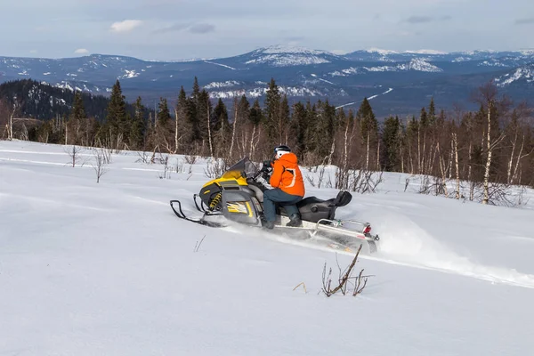 Athlete on a snowmobile — Stock Photo, Image