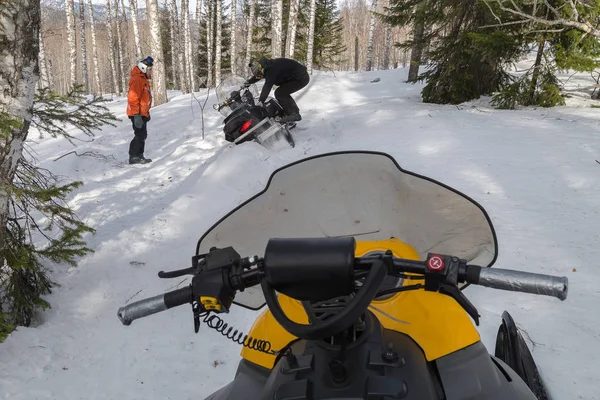 Athletes on a snowmobile — Stock Photo, Image