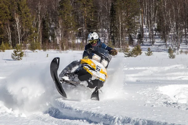 Athlete on a snowmobile. — Stock Photo, Image