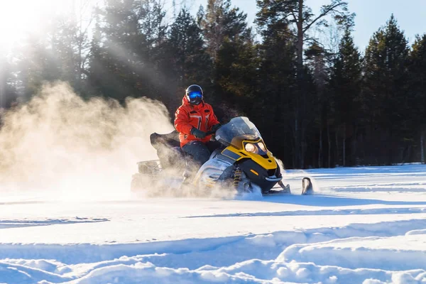 Athlete on a snowmobile — Stock Photo, Image