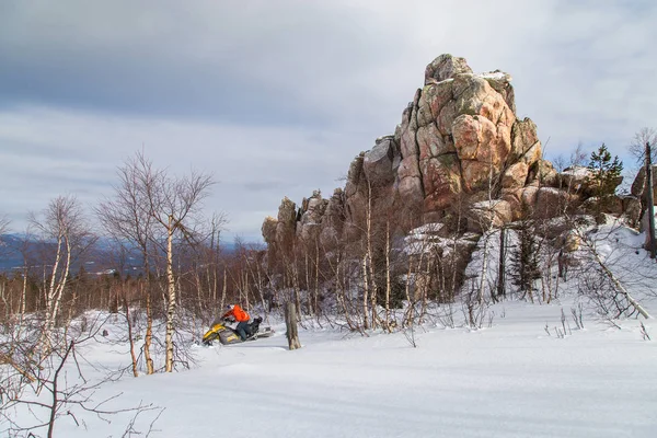 Athlete on a snowmobile — Stock Photo, Image