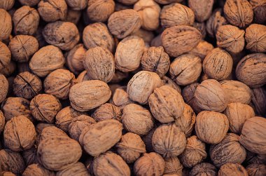 Birçok ceviz Satılık. Ceviz doku ve arka plan. Sağlıklı organik gıda kavramı. Görünümü yukarıdaki