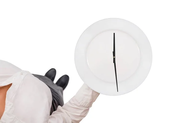 Top view of a waitress in a white blouse carrying empty serving plate as a clock with arrows on the white background. Concept. Isolated