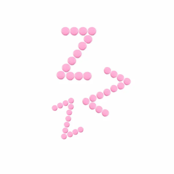 白い背景にZ字型のピンクの錠剤 睡眠薬催眠薬鎮静剤不眠症だ心理学 — ストック写真