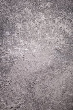 Eski siyah ve gri beton bir duvarın dokusu ve arka planı. Çimento