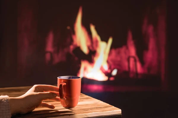 Woman Winter Sweater Relaxes Sitting Christmas Fireplace Cup Hot Drink — 스톡 사진