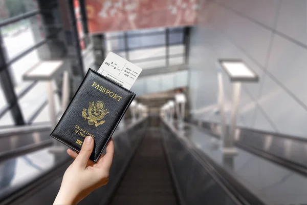 Woman Hand Holding American Passport Boarding Pass Airport Escalator — Stock Photo, Image